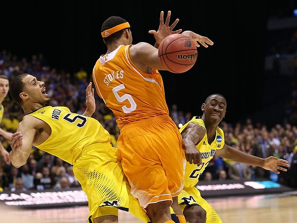 Jordan Morgan (52), Caris LeVert (23), and Nik Stauskas (11)