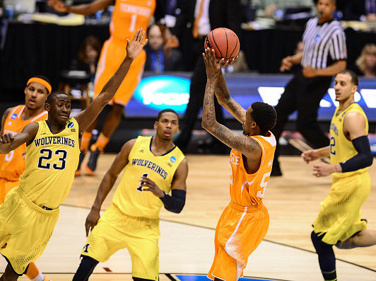 Caris LeVert (23), Glenn Robinson III (1), and Jordan Morgan (52)