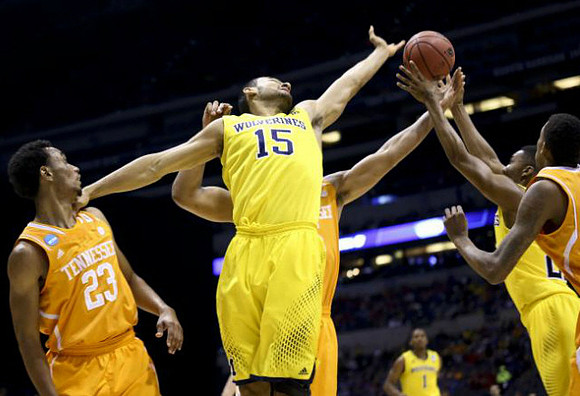 Jon Horford (15), Zak Irvin (21), and Glenn Robinson III (1)