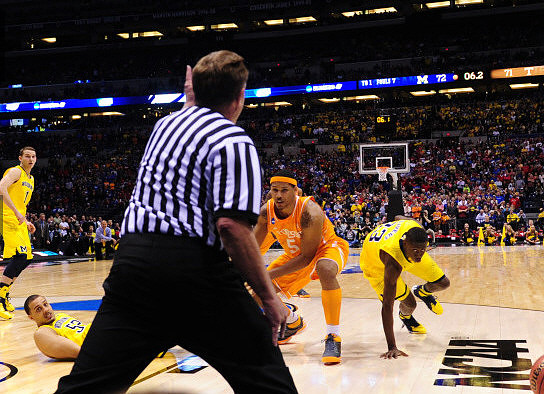 Nik Stauskas (11), Jordan Morgan (52), and Caris LeVert (23)