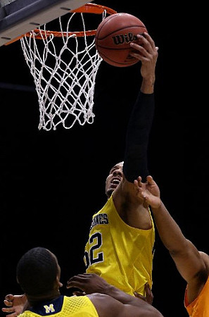 Glenn Robinson III (1) and Jordan Morgan (52)