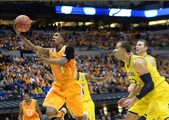 Caris LeVert (23), Jordan Morgan (52), and Nik Stauskas (11)