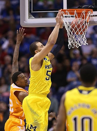 Jordan Morgan (52) and Derrick Walton Jr. (10)