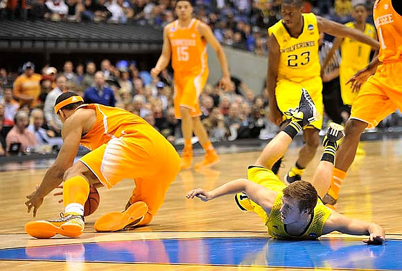 Spike Albrecht (2), Caris LeVert (23), and Glenn Robinson III (1)