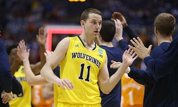 Derrick Walton Jr. (10) and Nik Stauskas (11)
