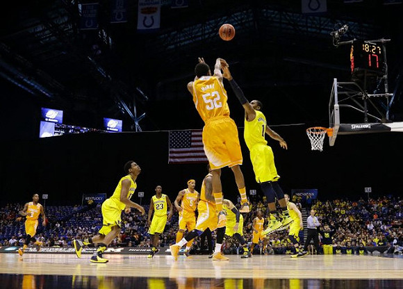 Derrick Walton Jr. (10), Caris LeVert (23), Jordan Morgan (52), Glenn Robinson III (1), and Nik Stauskas (11)