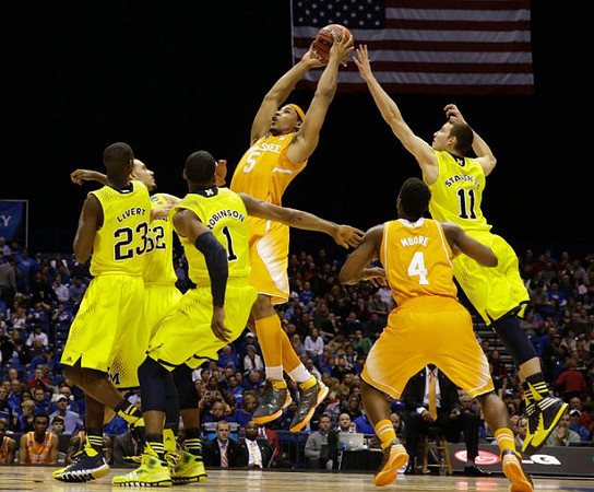 Caris LeVert (23), Jordan Morgan (52), Glenn Robinson III (1), and Nik Stauskas (11)