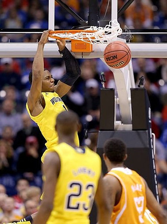 Glenn Robinson III (1) and Caris LeVert (23)