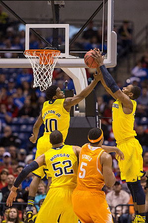 Derrick Walton Jr. (10), Jordan Morgan (52), and Glenn Robinson III (1)