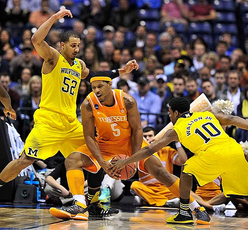 Jordan Morgan (52) and Derrick Walton Jr. (10)