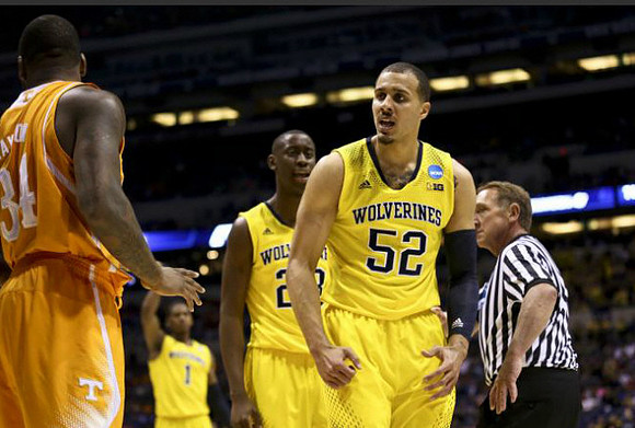 Glenn Robinson III (1), Caris LeVert (23), and Jordan Morgan (52)