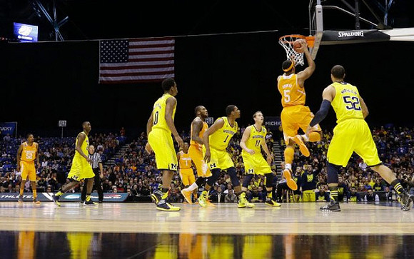 Caris LeVert (23), Derrick Walton Jr. (10), Glenn Robinson III (1), Nik Stauskas (11), and Jordan Morgan (52)