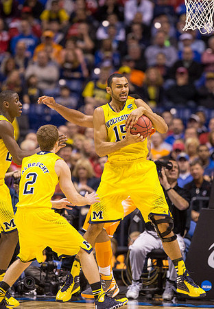 Caris LeVert (23), Spike Albrecht (2), and Jon Horford (15)