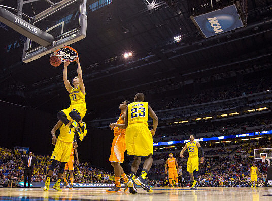 Nik Stauskas (11), Glenn Robinson III (1), Caris LeVert (23), Jordan Morgan (52), and Derrick Walton Jr. (10)