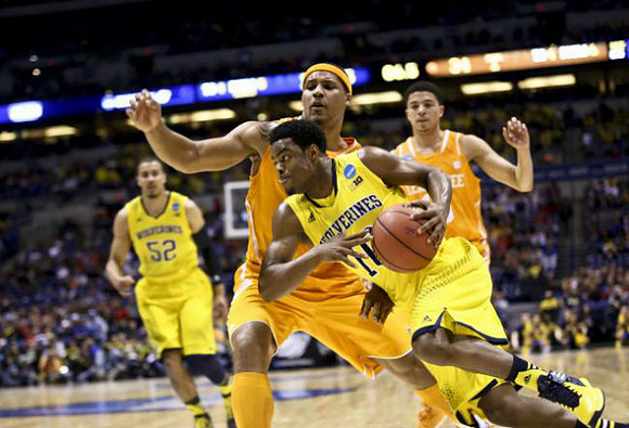Jordan Morgan (52) and Derrick Walton Jr. (10)