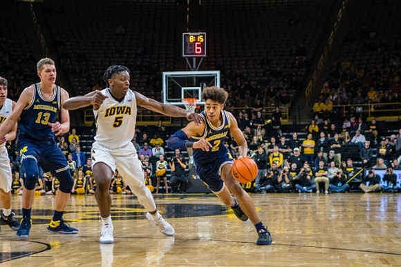 Moritz Wagner (13) and Jordan Poole (2)
