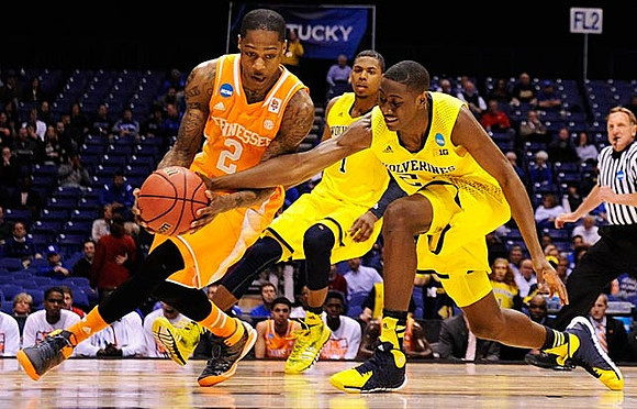 Glenn Robinson III (1) and Caris LeVert (23)