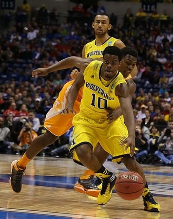 Derrick Walton Jr. (10) and Jon Horford (15)