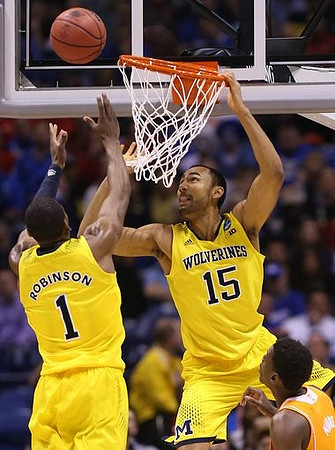 Glenn Robinson III (1) and Jon Horford (15)