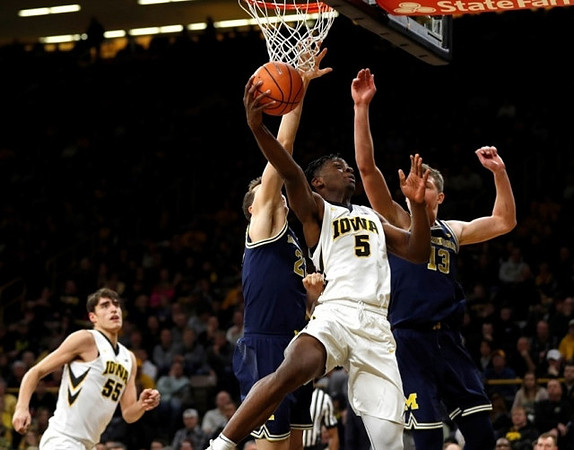 Duncan Robinson (22) and Moritz Wagner (13)
