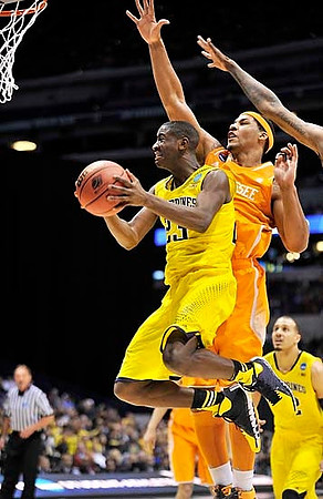 Caris LeVert (23) and Jordan Morgan (52)