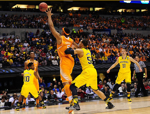 Derrick Walton Jr. (10), Jordan Morgan (52), and Nik Stauskas (11)