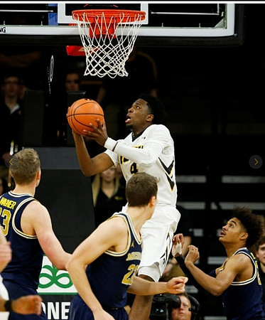 Moritz Wagner (13), Duncan Robinson (22), and Jordan Poole (2)