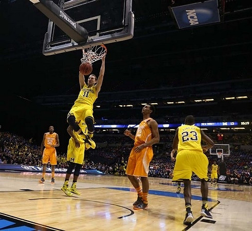 Nik Stauskas (11), Glenn Robinson III (1), and Caris LeVert (23)