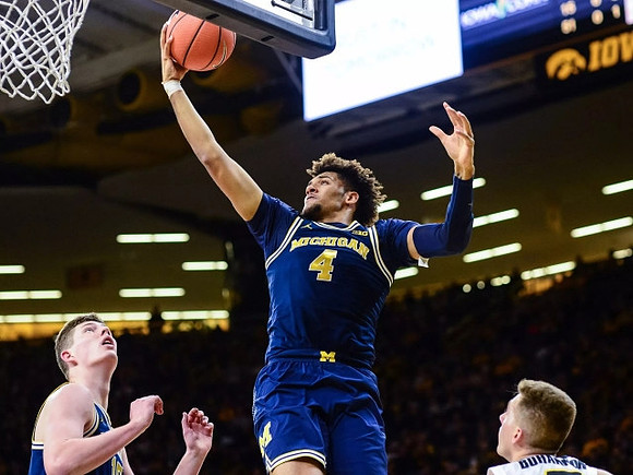 Isaiah Livers (4) and Jon Teske (15)
