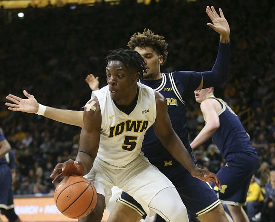 Isaiah Livers (4) and Jon Teske (15)