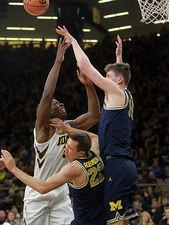 Duncan Robinson (22) and Jon Teske (15)