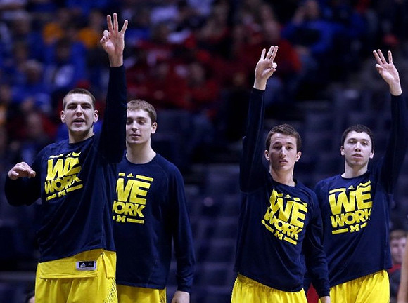 Mitch McGary (4), Mark Donnal (34), Andrew Dakich (5), and Sean Lonergan (20)