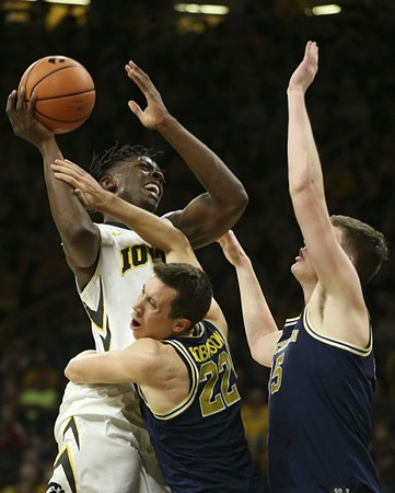 Duncan Robinson (22) and Jon Teske (15)