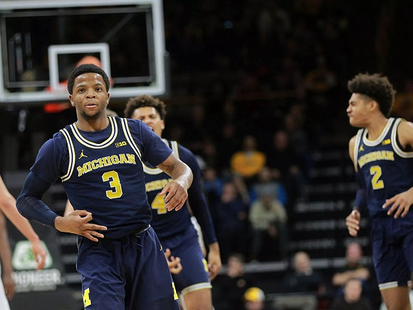 Zavier Simpson (3), Isaiah Livers (4), and Jordan Poole (2)