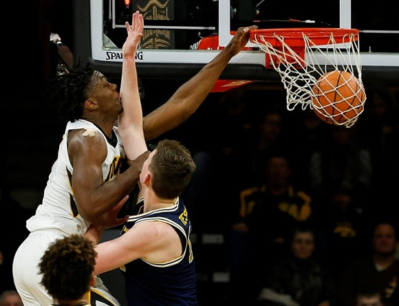 Isaiah Livers (4) and Jon Teske (15)