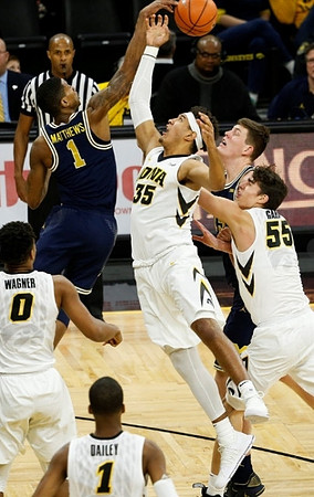 Charles Matthews (1) and Jon Teske (15)