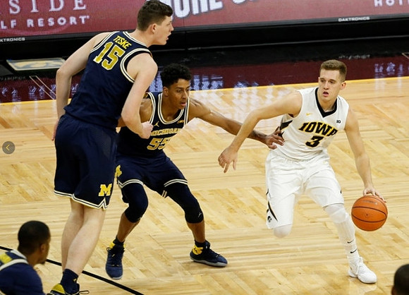 Muhammad-Ali Abdur-Rahkman (12), Jon Teske (15), and Eli Brooks (55)