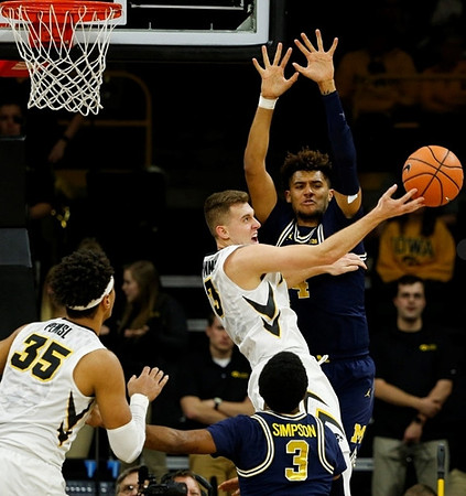 Zavier Simpson (3) and Isaiah Livers (4)