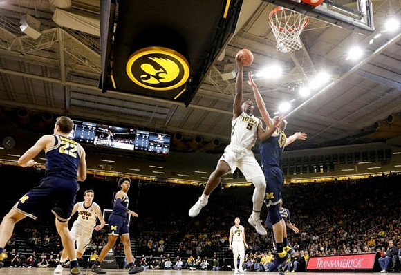 Duncan Robinson (22), Jordan Poole (2), and Moritz Wagner (13)