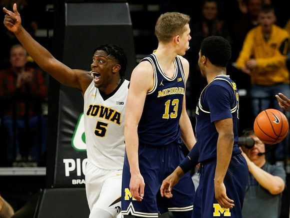 Moritz Wagner (13) and Zavier Simpson (3)