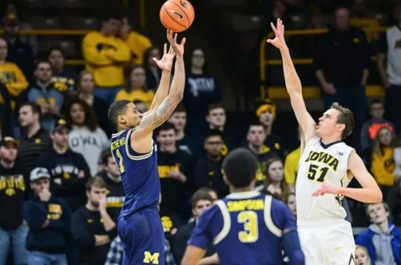 Charles Matthews (1) and Zavier Simpson (3)