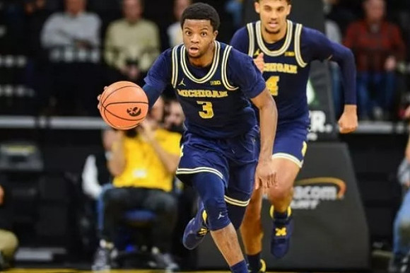 Zavier Simpson (3) and Isaiah Livers (4)