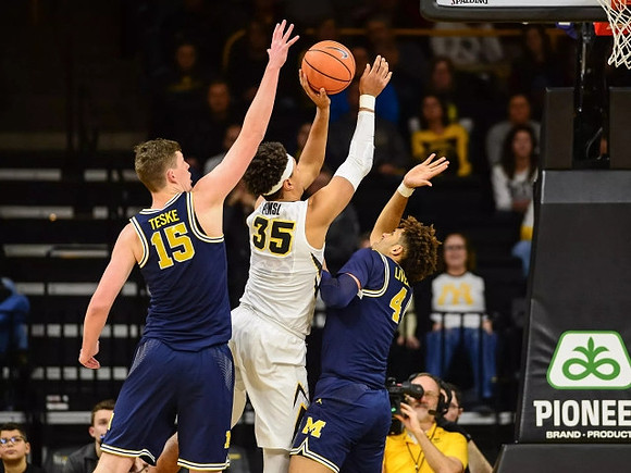 Jon Teske (15) and Isaiah Livers (4)