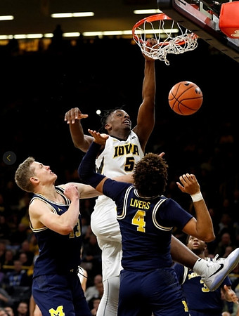 Moritz Wagner (13) and Isaiah Livers (4)