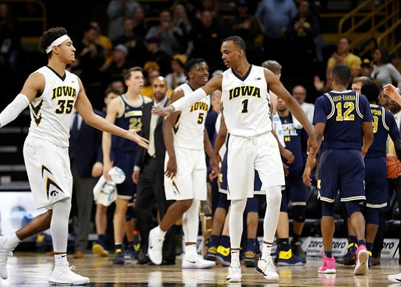 Duncan Robinson (22), Muhammad-Ali Abdur-Rahkman (12), and Zavier Simpson (3)