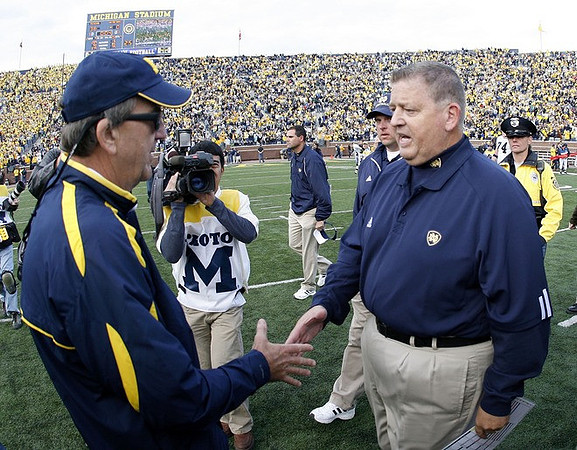 Lloyd Carr and Charlie Weis