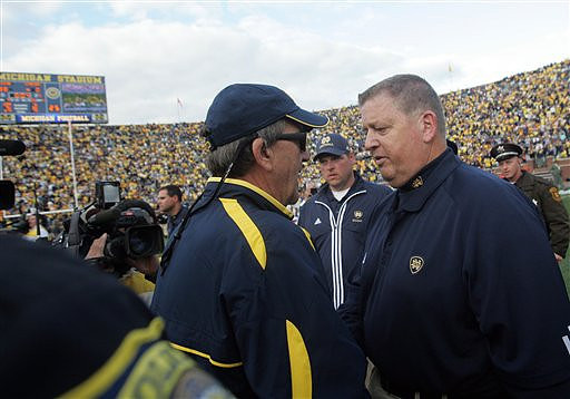 Lloyd Carr and Charlie Weis