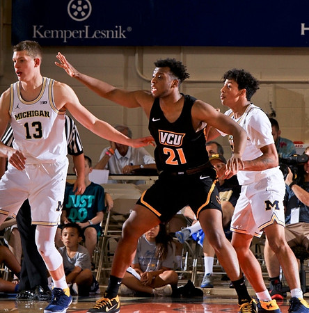 Moritz Wagner (13) and Eli Brooks (55)