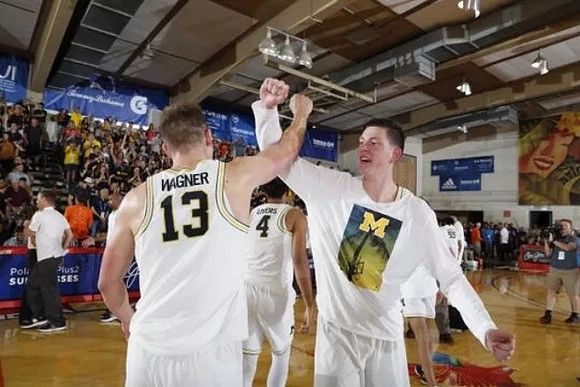 Moritz Wagner (13), Isaiah Livers (4), and Jon Teske (15)