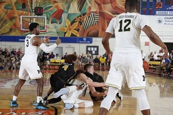 Zavier Simpson (3), Moritz Wagner (13), and Muhammad-Ali Abdur-Rahkman (12)